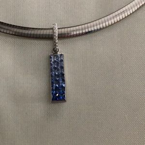 14 karat white gold pendant with blue sapphires